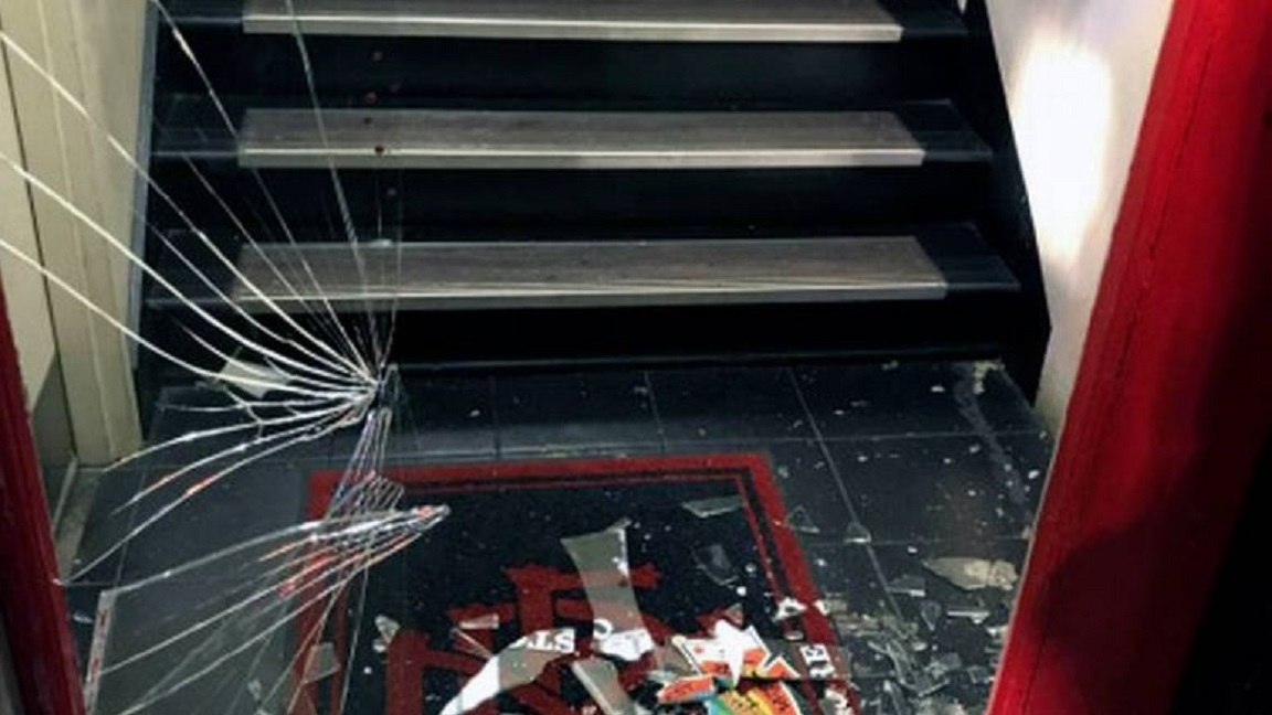 A shattered glass window on a door to a Modesto fire station where a man high on methamphetamine broke inside on Wednesday, Aug. 15, 2018.