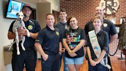 Richmond firefighters pictured with a group of youngsters who recently taught them about the benefits of learning American Sign Language. Richmond firefighters pictured with a group of youngsters who recently taught them about the benefits of learning American Sign Language.