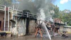 Firefighters pour water on a fire that broke out at a sewage treatment plant in Highland Falls, NY, on Wednesday, Aug. 15, 2018. Firefighters pour water on a fire that broke out at a sewage treatment plant in Highland Falls, NY, on Wednesday, Aug. 15, 2018.