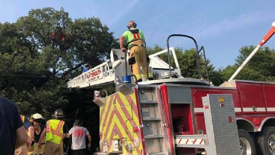 Plattsmouth firefighters extend an aerial ladder during a rescue of a skydiver who crashed into a tree and got stuck 70 feet up for three hours on Saturday, Aug. 25, 2018.