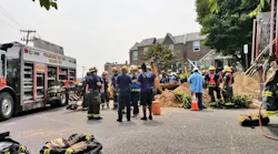 Philadelphia firefighters on scene during efforts to rescue a worker who was found dead after a trench collapse on Thursday, Aug. 16, 2018.