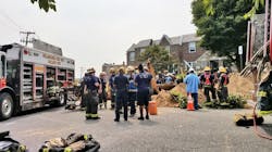 Philadelphia firefighters on scene during efforts to rescue a worker who was found dead after a trench collapse on Thursday, Aug. 16, 2018.