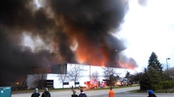 The RoomPlace warehouse burns in an arson fire in the southwestern Chicago suburb of Woodridge on April 21, 2016.
