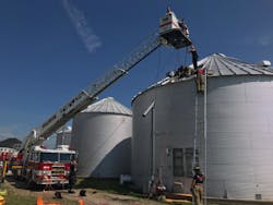 Upon arrival, the aerial was extended to prepare for the rescue of the man from the grain bin. Upon arrival, the aerial was extended to prepare for the rescue of the man from the grain bin.