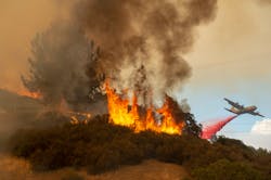 Fire retardant is dropped near a home as the Mendocino Complex Fire burns near Lakeport on July 30, 2018. Fire retardant is dropped near a home as the Mendocino Complex Fire burns near Lakeport on July 30, 2018.