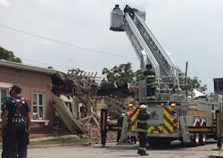 Denver firefighters on scene after nine people were injured in a suspected natural gas explosion that leveled an apartment building on Tuesday, Aug. 14, 2018.
