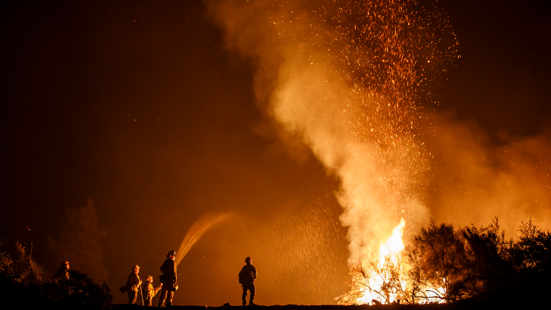 Firefighters monitor a burn operation during the historic Mendocino Complex fire in August.
