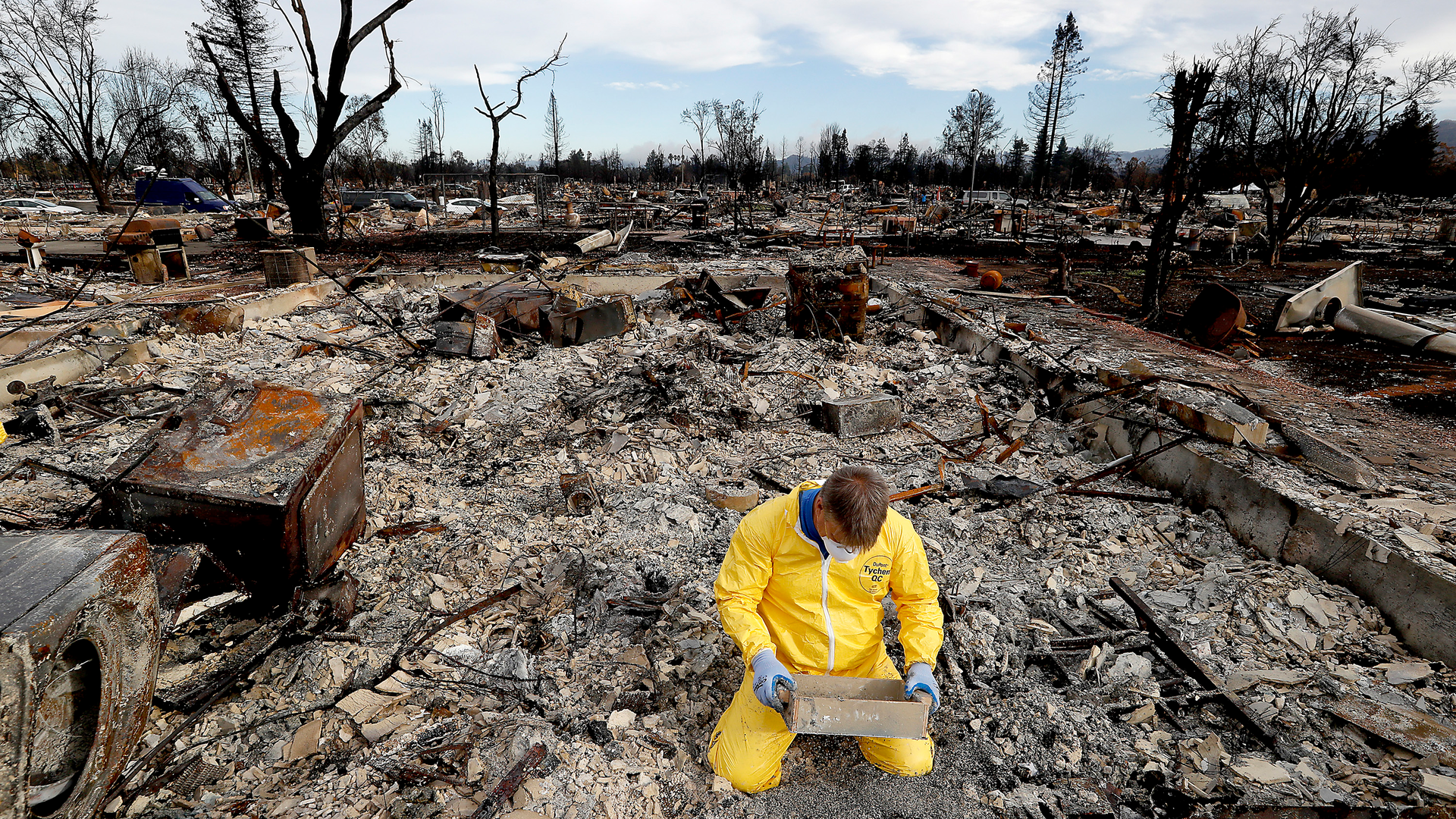 Mark Sharp sifts through the remains of his charred home in Santa Rosa in search of his wife's wedding band in October 2017.