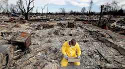 Mark Sharp sifts through the remains of his charred home in Santa Rosa in search of his wife's wedding band in October 2017.