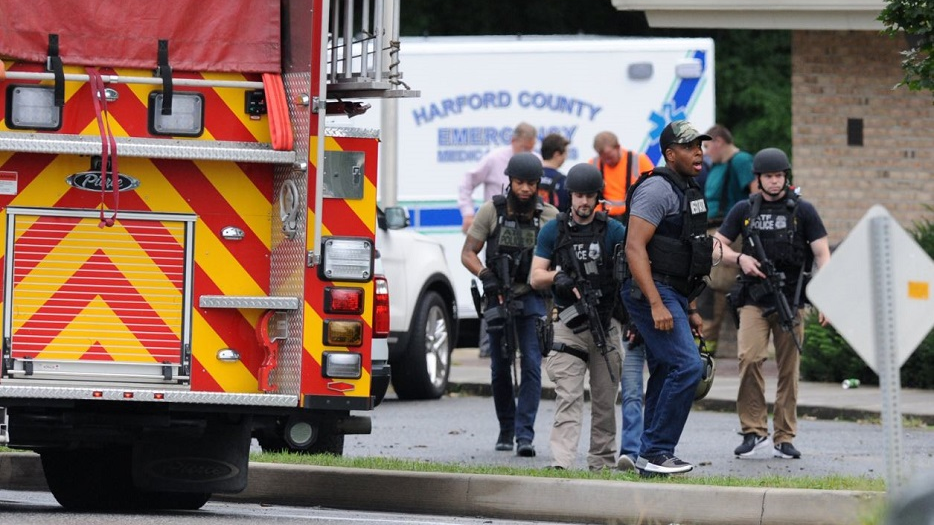 A group of ATF agents make their way to the scene after staging at the Aberdeen Volunteer Fire Department sub-station near a shooting incident in Aberdeen, MD, on Thursday, Sept. 20, 2018.
