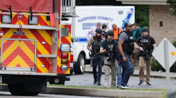 A group of ATF agents make their way to the scene after staging at the Aberdeen Volunteer Fire Department sub-station near a shooting incident in Aberdeen, MD, on Thursday, Sept. 20, 2018.