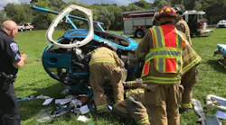 West Bloomfield firefighters on scene after a private helicopter crashed in Orchard Lake, MI, on Monday, Sept. 03, 2018.