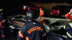 Bridgeport, CT, firefighters prepare to launch a skiff as they conduct search and rescue operations amid flood conditions on Tuesday, Sept. 25, 2018.