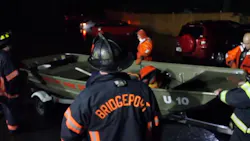 Bridgeport, CT, firefighters prepare to launch a skiff as they conduct search and rescue operations amid flood conditions on Tuesday, Sept. 25, 2018.