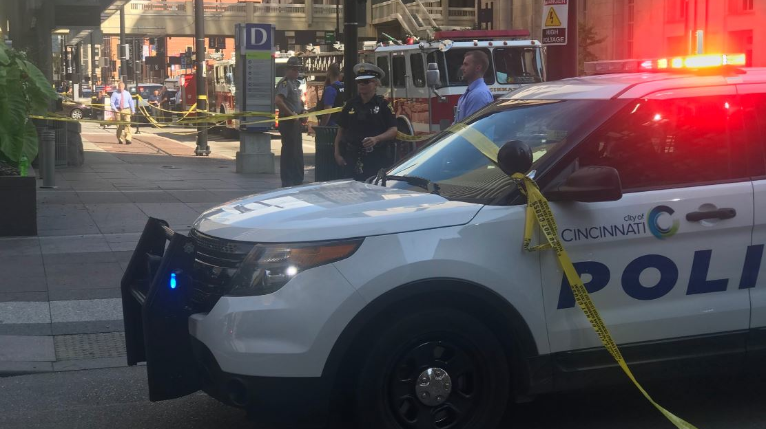 Emergency personnel remain on scene after a gunman killed three people before police shot and killed him at a bank in downtown Cincinnati on Thursday, Sept. 6, 2018.