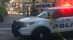 Emergency personnel remain on scene after a gunman killed three people before police shot and killed him at a bank in downtown Cincinnati on Thursday, Sept. 6, 2018.
