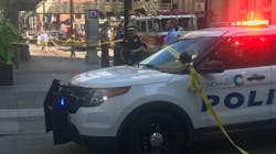Emergency personnel remain on scene after a gunman killed three people before police shot and killed him at a bank in downtown Cincinnati on Thursday, Sept. 6, 2018.