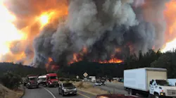 Vehicles are left abandoned on Interstate 5 near Redding, CA, as the Delta Fire swiftly moves toward the roadway on Wednesday, Sept. 5, 2018.