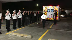 Chicago firefighters salute as an ambulance brings the body of Capt. Darryl Moore to the Cooke County Medical Examiner's Office on Monday, Sept. 17, 2018.