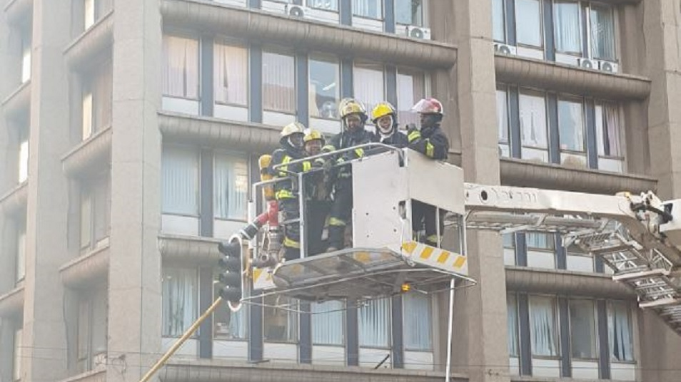 Firefighters are bought down from the upper floors of a high-rise after containing a fire that took the lives of three colleagues in Johannesburg, South Africa, on Wednesday, Sept. 5, 2018.