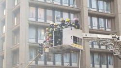 Firefighters are bought down from the upper floors of a high-rise after containing a fire that took the lives of three colleagues in Johannesburg, South Africa, on Wednesday, Sept. 5, 2018.