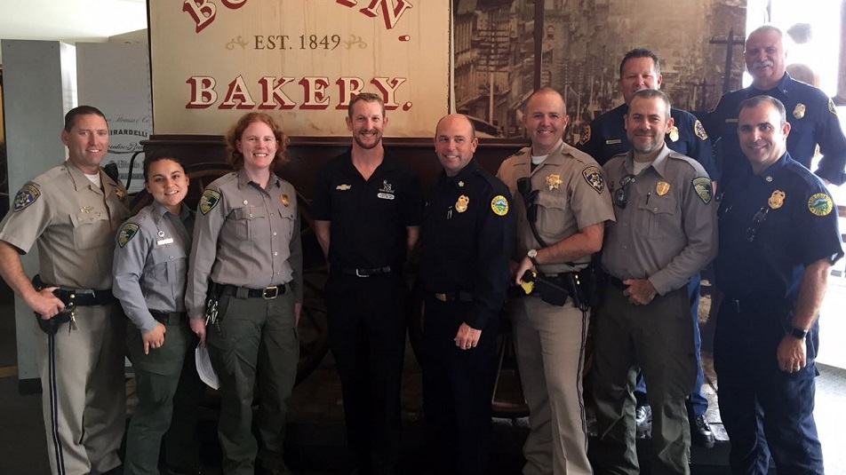 IndyCar Series driver Charlie Kimball, fourth from left, with first responders who worked the 2017 North Bay fires.