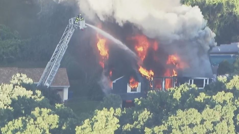 Firefighters battle a house fire in Lawrence, MA, after a series of gas explosion on Sept. 13, 2018.
