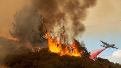 Fire retardant is dropped near a home as the Mendocino Complex burns west of Lakeport, CA, on July 30, 2018. Fire retardant is dropped near a home as the Mendocino Complex burns west of Lakeport, CA, on July 30, 2018.