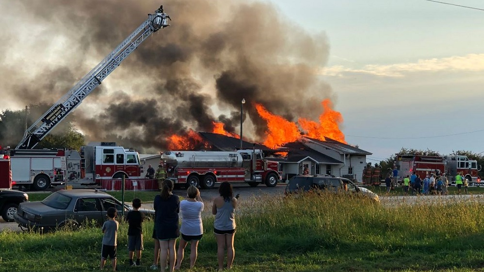 Firefighters battle a large blaze at the Hilltop Restaurant in Middlebury, IN, on Tuesday, Sept. 18, 2018.