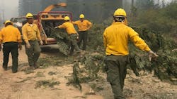 Army National Guard members clearing brush during efforts to contain the Miriam Fire in Lewis County, WA, on Aug. 28, 2018.