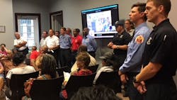 Moss Point, MS, firefighters attend a board meeting on Tuesday, Sept. 18, 2018, where they presented a petition of protest on a proposed restructuring of the city&apos;s fire department.