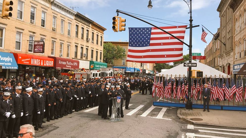 FDNY members gather on Wednesday, Sept. 26, 2018, to honor firefighter William Tolley at a ceremony unveiling a plaque and renaming a Queens street after him.