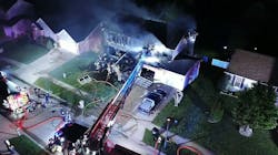 This image captured from footage recorded from a drone shows firefighters battling a fire caused by an explosion at a home in Wentzville on Tuesday, Sept. 4, 2018.