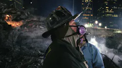 Rescue 5 firefighter Joey Esposito wears a breathing mask during recovery efforts at the World Trade Center in Lower Manhattan in December 2001.