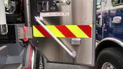 The inside door panel on this apparatus is equipped with a full height stainless-steel panel, LED warning light and angled handrail. Note the red color webbing over the door strap, which can be used to assist personnel entering the crew cab area. The inside door panel on this apparatus is equipped with a full height stainless-steel panel, LED warning light and angled handrail. Note the red color webbing over the door strap, which can be used to assist personnel entering the crew cab area.