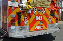 The rear hosebed on Engine 842 from Prince George’s County, MD, was designed to permit personnel to advance attack lines without having to climb onto the rear step. Note the angled rear step, rear body clearance lights and poly rub rail to protect the body and roll-up doors. The rear hosebed on Engine 842 from Prince George’s County, MD, was designed to permit personnel to advance attack lines without having to climb onto the rear step. Note the angled rear step, rear body clearance lights and poly rub rail to protect the body and roll-up doors.