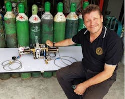 EasyTek President Stephen Burton with the Haskel oxygen boost pump used in the cave rescue. EasyTek President Stephen Burton with the Haskel oxygen boost pump used in the cave rescue.