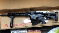 Prosecutors say Kansas City, MO, fire Capt. James Samuels sold this AR-15 .223-caliber rifle and ammunition to a confidential informant he believed was a convicted felon. Prosecutors say Kansas City, MO, fire Capt. James Samuels sold this AR-15 .223-caliber rifle and ammunition to a confidential informant he believed was a convicted felon.