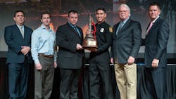 Firefighter Bryce Gutierrez of the Los Angeles Fire Department (LAFD) receiving the 2017 Firehouse Michael O. McNamee Award of Valor at Firehouse Expo in Nashville, TN, on Thursday, Oct. 18, 2018.