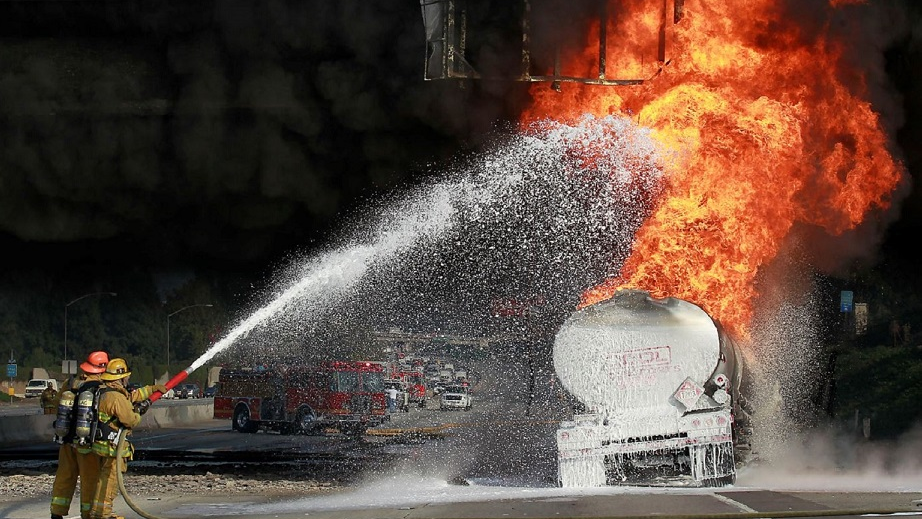 Los Angeles County firefighters put foam on a gasoline tanker which caught fire in Montebello, CA, in December 2011.