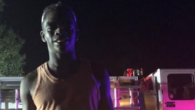 Keshaun Smith, 18, pictured right after he ran into a neighbor's house with two fire extinguishers and doused a fire in the kitchen before firefighters arrived in Lakeland, FL, on Wednesday, Oct. 17, 2018.