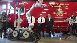 Orlando fire officials join Mayor Buddy Dyer, right, in unveiling a new bomb squad robot on Tuesday, Oct. 16, 2018. Orlando fire officials join Mayor Buddy Dyer, right, in unveiling a new bomb squad robot on Tuesday, Oct. 16, 2018.