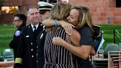 Mynda Smith, right, hugs Mary Jo Von Tillow after a sunrise remembrance to mark the one year anniversary of the Las Vegas mass shooting at the Clark County Government Center amphitheater on Monday, Oct. 1, 2018, in Las Vegas. Smith's sister Neysa Tonks and Von Tillow's husband Kurt Von Tillow were killed in the shooting. Mynda Smith, right, hugs Mary Jo Von Tillow after a sunrise remembrance to mark the one year anniversary of the Las Vegas mass shooting at the Clark County Government Center amphitheater on Monday, Oct. 1, 2018, in Las Vegas. Smith's sister Neysa Tonks and Von Tillow's husband Kurt Von Tillow were killed in the shooting.