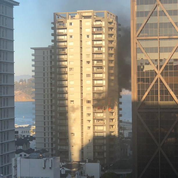 Fire burns on several floors of a San Francisco residential high-rise on Monday, Oct. 22, 2018.