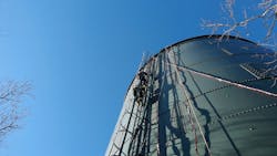 Firefighters descend the water tank via a caged fixed ladder way that begins approximately 10 feet off the ground. Firefighters descend the water tank via a caged fixed ladder way that begins approximately 10 feet off the ground.