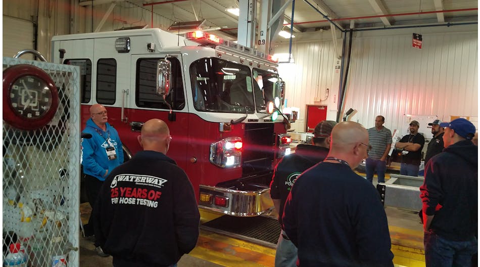 Emergency Vehicle Technicians check out a newly completed cab and chassis at Spartan Motors&apos; plant in Charlotte, MI.