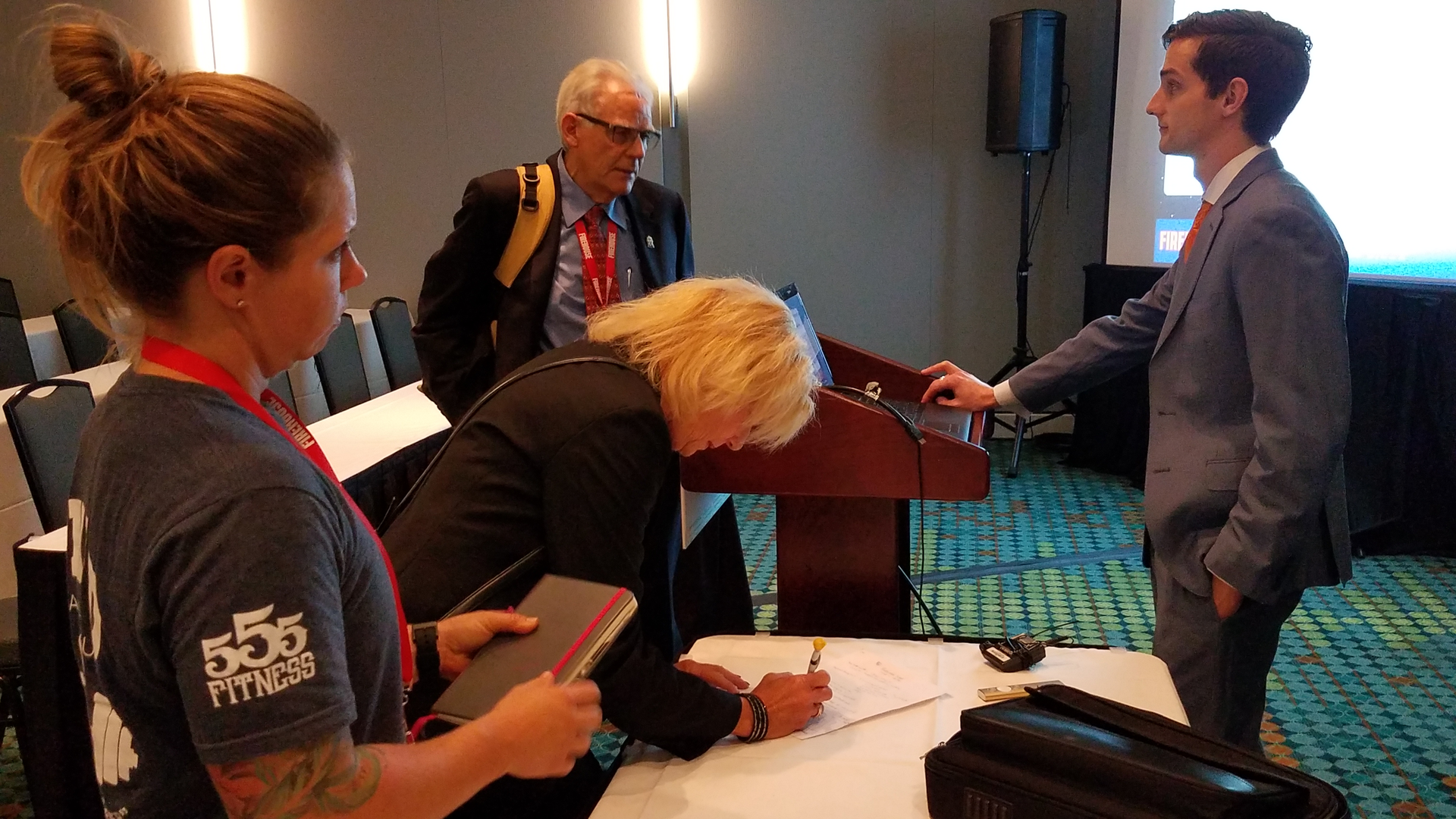 Joel M. Billing, Ph.D. Candidate at Oklahoma State University, right, talks to Firehouse Expo attendees after his presentation.