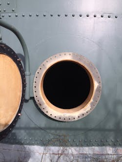 At the bottom of the water tank were two approximately 30-inch manholes that could be used for access once the covers were taken off. It was unknown how long the water would take to drain out of the tank. At the bottom of the water tank were two approximately 30-inch manholes that could be used for access once the covers were taken off. It was unknown how long the water would take to drain out of the tank.