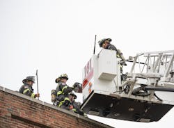 Champaign firefighters work at a recent building fire. Champaign firefighters work at a recent building fire.