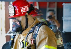 Cal Fire Capt. Ryan Villarino trains on a new style of a self-contained breathing apparatus.